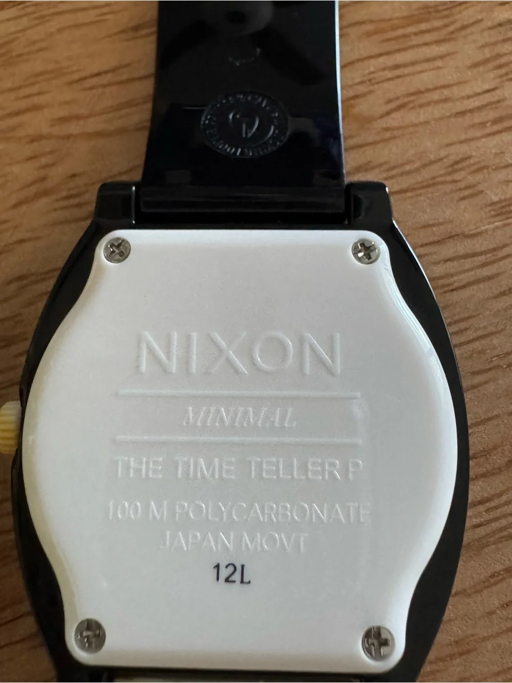 Nixon Black and White Dial Watch with Gold Crown